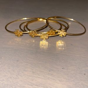 Bundle of 5 Tory Burch bangle bracelets.